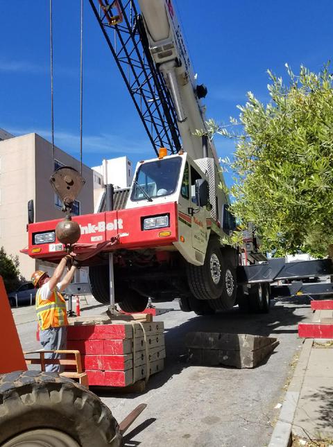 Our 90-ton crane setting steel at a construction job in San Francisco on a steep hill